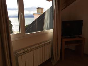 TV a/nebo společenská místnost v ubytování NBH Nativo Boutique Hotel