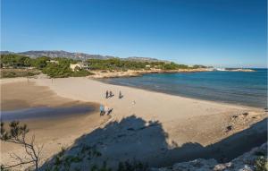 a group of people walking on a beach at Cozy Home In Hospitalet De Linfant in Hospitalet de l'Infant