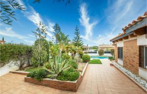 a house with a courtyard with a swimming pool at Cozy Home In Hospitalet De Linfant in Hospitalet de l'Infant +26 photos