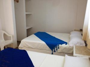 Postel nebo postele na pokoji v ubytování QUINTA DIAMANTE villas&hotel
