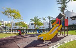 a playground with a slide in a park at 2 Bedroom Nice Apartment In Roldán in Los Tomases