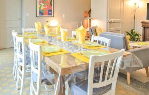 a dining room with a table and chairs at Pet Friendly Home In Aurseulles in Anctoville