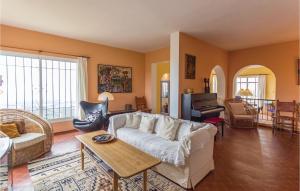 a living room with a couch and a piano at El Peascal in Marbella