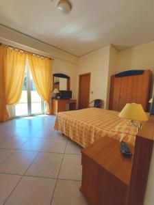 Posteľ alebo postele v izbe v ubytovaní Sait Hotel & BB