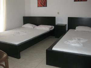 Ένα ή περισσότερα κρεβάτια σε δωμάτιο στο Philippos & Maria Apartments