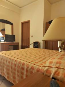 Posteľ alebo postele v izbe v ubytovaní Sait Hotel & BB