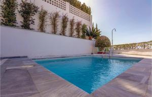 a swimming pool in the middle of a building at Amazing Home In Almuñecar in Almuñécar