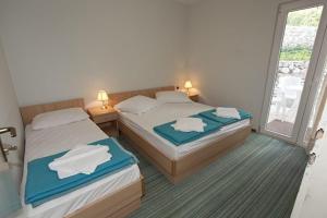 Postel nebo postele na pokoji v ubytování Holiday House Zorra