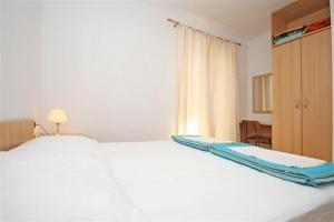 Postel nebo postele na pokoji v ubytování Holiday House Zorra