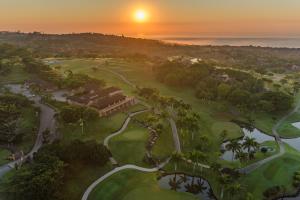 an aerial view of a golf course at sunset at San Lameer Villa 10425 - 1 Bedroom Classic - 2 pax - San Lameer Rental Agency in Southbroom