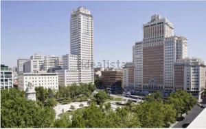 a city skyline with tall buildings and a park at Plaza España & Gran Via 2BD 1BTH in Madrid