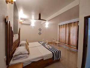 Ein Bett oder Betten in einem Zimmer der Unterkunft Liberty Guesthouse Maldives