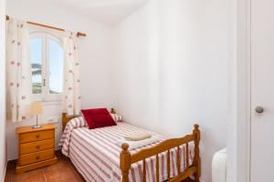 Ein Bett oder Betten in einem Zimmer der Unterkunft Apartamento Ses Arcades 10