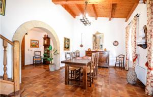 a kitchen and dining room with a table and chairs at Lovely Home In Roussillon With Kitchen in Roussillon