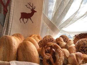 a bunch of different types of pastries on a table at Landhaus am Rosenbächle in Pfronten +5 photos