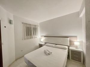 A bed or beds in a room at APARTMENT IN BENIDORM CITY CENTER