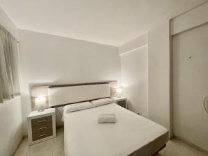 Postel nebo postele na pokoji v ubytování APARTMENT IN BENIDORM CITY CENTER