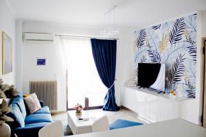 A television and/or entertainment centre at Ermis Mini Suite # 3