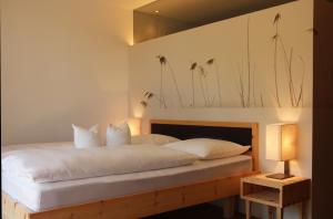 Postel nebo postele na pokoji v ubytování Steindl's Boutique Hotel