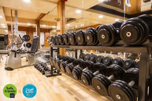 a row of dumbbells on display in a gym at Prezident Hotel in Novi Sad