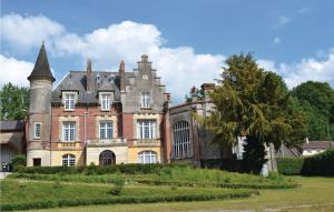 an old castle with a tower on top of it at Amazing Home In Marconne With Kitchen in Marconne