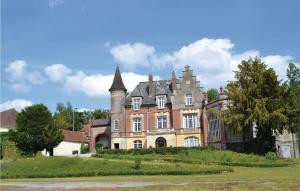 an old house with a castle on a hill at Amazing Home In Marconne With Kitchen in Marconne