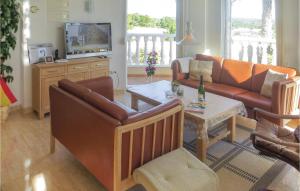a living room with a couch and a table at Beautiful Home In Quesada-Rojales in Rojales