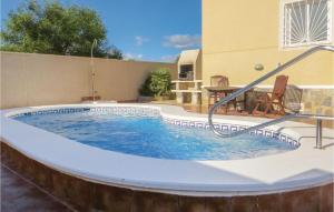 a swimming pool in the middle of a patio at Beautiful Home In Quesada-Rojales in Rojales