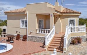 a house with a staircase in front of it at Beautiful Home In Quesada-Rojales in Rojales +21 photos