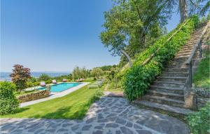 an estate with a swimming pool and stairs at Antico Pod, Querceto in Molinelli