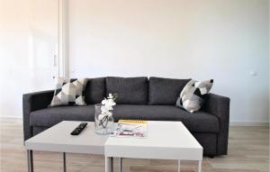 a living room with a couch and a white coffee table at Amazing Apartment In Torrevieja in La Mata