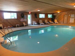 a large swimming pool in a wooden building at The Nordic Lodge in Sister Bay