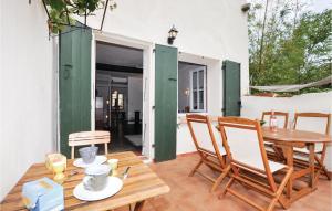 a patio with a wooden table and chairs at Amazing Home In Ceret With Wifi in Céret