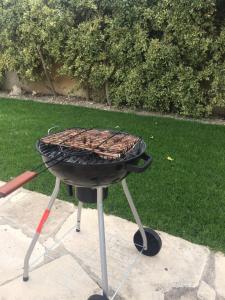 a grill with a basket on top of it at Villa SeaBerry in Coral Bay