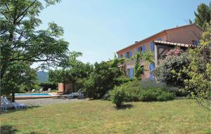 a house with a swimming pool in a yard at 4 Bedroom Awesome Home In Roquebrun in Roquebrun