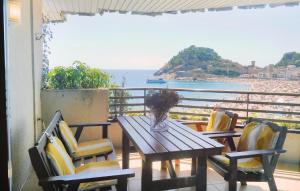 a table and chairs with a view of the ocean at Nice Apartment In Tossa De Mar in Tossa de Mar