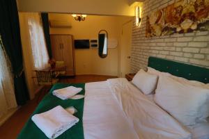 Postel nebo postele na pokoji v ubytování Stone Home Apart
