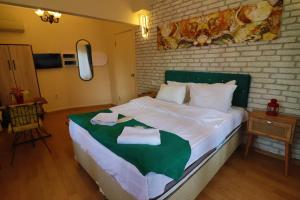 Postel nebo postele na pokoji v ubytování Stone Home Apart