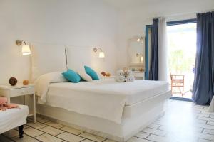 Ένα ή περισσότερα κρεβάτια σε δωμάτιο στο Nissiotiko Studios & Apartments