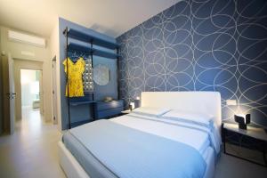 A bed or beds in a room at Nerodavola by PosarelliVillas