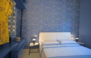 A bed or beds in a room at Nerodavola by PosarelliVillas