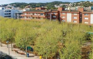 a view of a city with trees and buildings at Beautiful Apartment In Tossa De Mar in Tossa de Mar