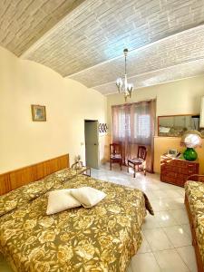 Ένα ή περισσότερα κρεβάτια σε δωμάτιο στο Raggio di Sole