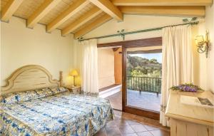 a bedroom with a bed and a balcony at Bilo 4 in Porto Cervo