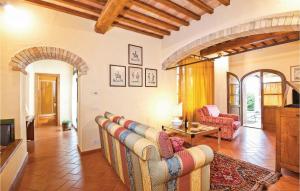 a living room with a couch and a table at Piazzale 2 in Castellina in Chianti