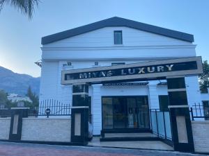 a building with a sign that reads kings library at MİYAS LUXURY HOTEL in Kemer