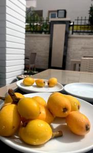 two white plates of fruit on a table at MİYAS LUXURY HOTEL in Kemer