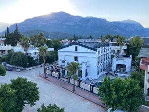 arial view of a city with mountains in the background at MİYAS LUXURY HOTEL in Kemer