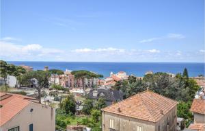 a city with houses and the ocean in the background at Gorgeous Home In Maria Di Castellabate in Santa Maria di Castellabate