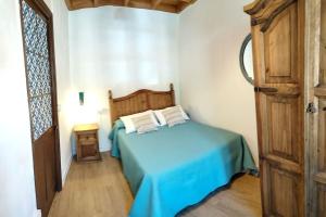 Posteľ alebo postele v izbe v ubytovaní La Casina Roja - Santolaya de Cabranes